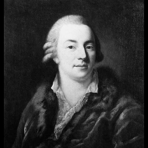 Black and white portrait of an 18th-century man wearing a fur-trimmed garment and a lace cravat. The man has a powdered wig and is looking directly at the viewer.